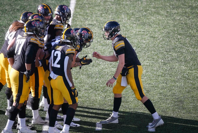 Iowa quarterback Spencer Petras calls a play in the huddle in the third quarter against Nebraska at Kinnick Stadium in Iowa City on Friday, Nov. 27, 2020.
