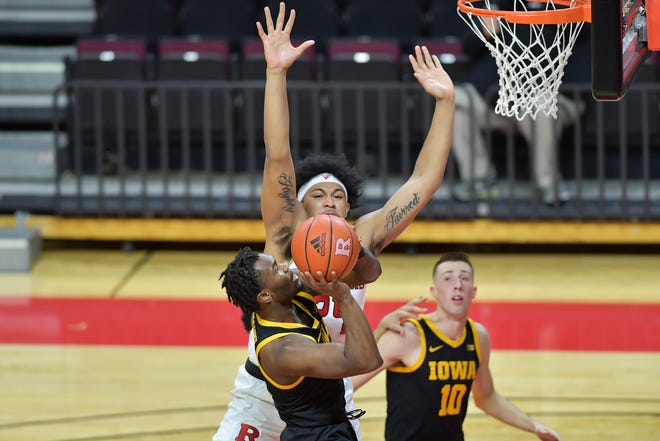Jan 2, 2021; Piscataway, New Jersey, USA; Iowa Hawkeyes guard (1) shoots the ball against Rutgers Scarlet Knights guard Ron Harper Jr. (24) during the first half at Rutgers Athletic Center (RAC). Mandatory Credit: Catalina Fragoso-USA TODAY Sports