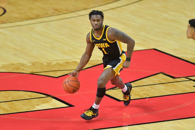 Jan 2, 2021; Piscataway, New Jersey, USA; Iowa Hawkeyes guard Joe Toussaint (1) controls the ball during the first half against the Rutgers Scarlet Knights at Rutgers Athletic Center (RAC). Mandatory Credit: Catalina Fragoso-USA TODAY Sports