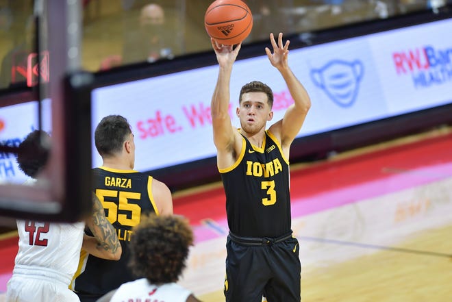 Jan 2, 2021; Piscataway, New Jersey, USA; Iowa Hawkeyes guard Jordan Bohannon (3) shoots the ball against the Rutgers Scarlet Knights during the first half at Rutgers Athletic Center (RAC). Mandatory Credit: Catalina Fragoso-USA TODAY Sports