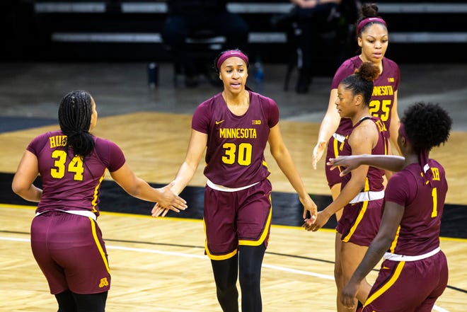 Minnesota forward Kadi Sissoko (30) celebrates with teammates after drawing a foul during a NCAA Big Ten Conference women's basketball game, Wednesday, Jan. 6, 2021, at Carver-Hawkeye Arena in Iowa City, Iowa.