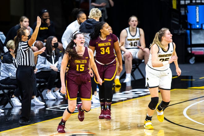 Minnesota forward Kayla Mershon (15) reacts after making a 3-point basket against Iowa center Monika Czinano (25) at the end of the first quarter during a NCAA Big Ten Conference women's basketball game, Wednesday, Jan. 6, 2021, at Carver-Hawkeye Arena in Iowa City, Iowa.
