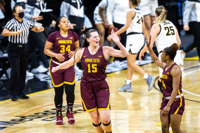 Minnesota forward Kayla Mershon (15) celebrates with teammate Minnesota guard Jasmine Powell (4) after making a basket during a NCAA Big Ten Conference women's basketball game, Wednesday, Jan. 6, 2021, at Carver-Hawkeye Arena in Iowa City, Iowa.