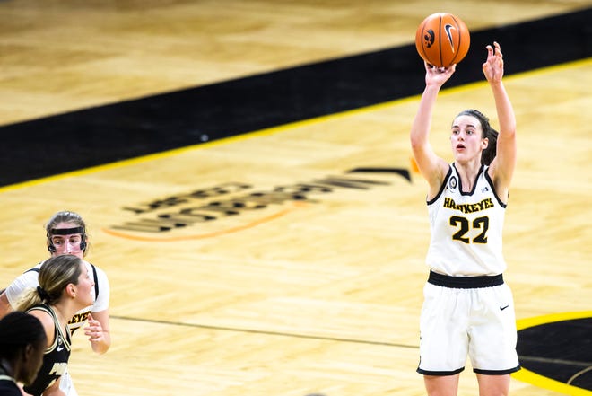Iowa guard Caitlin Clark (22) makes a 3-point basket during a NCAA Big Ten Conference women's basketball game against Purdue, Monday, Jan. 18, 2021, at Carver-Hawkeye Arena in Iowa City, Iowa.