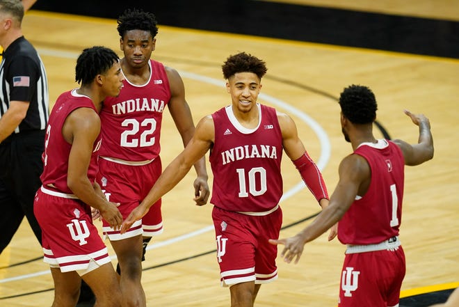 Indiana guard Rob Phinisee (10) celebrates with teammates during the second half of an NCAA college basketball game against Iowa on Thursday, Jan. 21, 2021, at Carver-Hawkeye Arena in Iowa City. Indiana won 81-69.