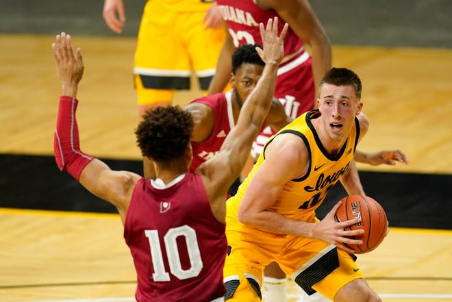 Iowa guard Joe Wieskamp, right, drives around Indiana guard Rob Phinisee (10) during the first half of an NCAA college basketball game, Thursday, Jan. 21, 2021, at Carver-Hawkeye Arena in Iowa City.
