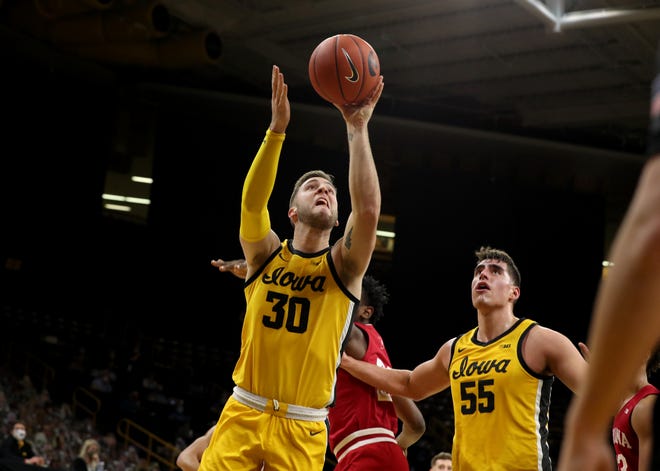 Iowa Hawkeyes guard Connor McCaffery (30) goes to the hoop against the Indiana Hoosiers Thursday, January 21, 2021 at Carver-Hawkeye Arena.