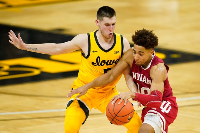 Iowa guard CJ Fredrick, left, tries to steal the ball from Indiana guard Rob Phinisee during the first half of an NCAA college basketball game, Thursday, Jan. 21, 2021, at Carver-Hawkeye Arena in Iowa City.