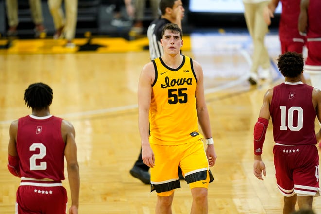 Iowa center Luka Garza walks to the bench during the second half of an NCAA college basketball game against Indiana on Thursday, Jan. 21, 2021, at Carver-Hawkeye Arena in Iowa City. Indiana won 81-69.
