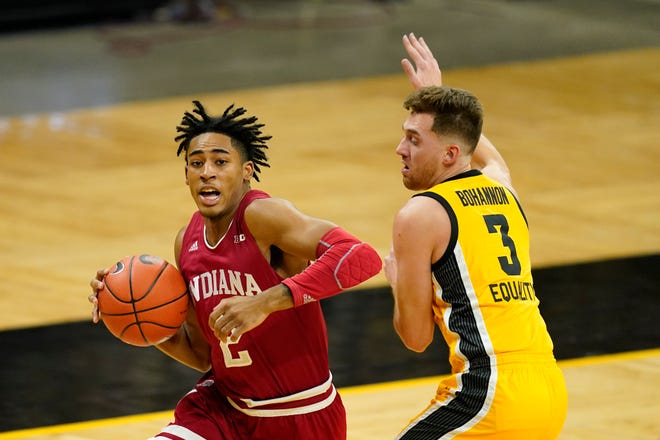 Indiana guard Armaan Franklin drives to the basket past Iowa guard Jordan Bohannon, right, during the first half of an NCAA college basketball game, Thursday, Jan. 21, 2021, at Carver-Hawkeye Arena in Iowa City.