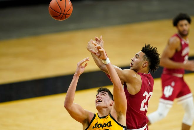 Iowa center Luka Garza fights for a rebound with Indiana forward Trayce Jackson-Davis (23) during the first half of an NCAA college basketball game, Thursday, Jan. 21, 2021, at Carver-Hawkeye Arena in Iowa City.