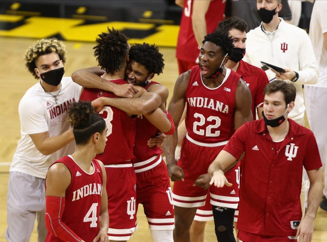 Forward Jerome Hunter #21 hugs forward Trayce Jackson-Davis of the Indian Hoosiers after their upset of the Iowa Hawkeyes on January 21, 2021, at Carver-Hawkeye Arena in Iowa City.
