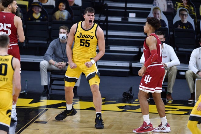 Iowa Hawkeyes center Luka Garza (55) reacts as Indiana Hoosiers guard Rob Phinisee (10) looks on during the first half at Carver-Hawkeye Arena on January 21, 2021.