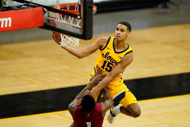 Iowa forward Keegan Murray (15) drives to the basket over Indiana guard Al Durham (1) during the second half of an NCAA college basketball game on Thursday, Jan. 21, 2021, at Carver-Hawkeye Arena in Iowa City. Indiana won 81-69.