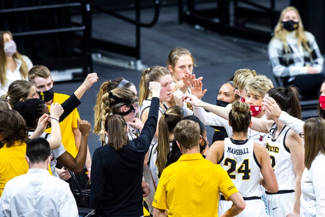 Iowa head coach Lisa Bluder huddles with players during the first half of a NCAA Big Ten Conference women's basketball game against Northwestern, Thursday, Jan. 28, 2021, at Carver-Hawkeye Arena in Iowa City, Iowa.