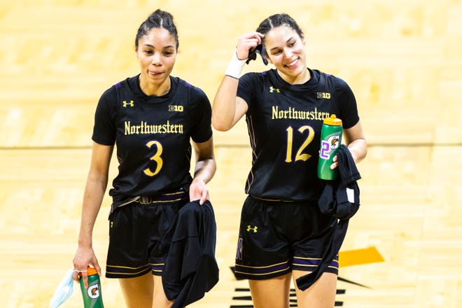 Northwestern's Sydney Wood (3) and Northwestern guard Veronica Burton (12) react after a NCAA Big Ten Conference women's basketball game, Thursday, Jan. 28, 2021, at Carver-Hawkeye Arena in Iowa City, Iowa.