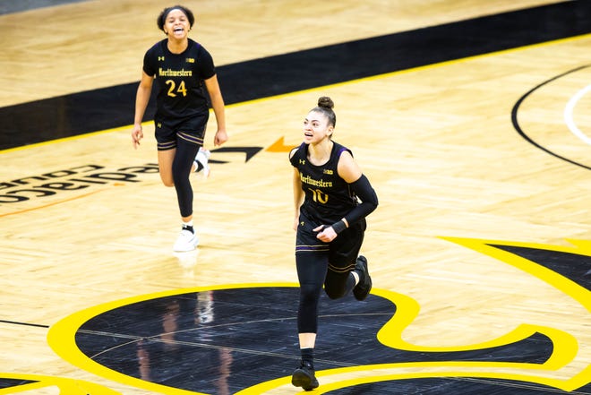 Northwestern guard Lindsey Pulliam (10) celebrates with teammate Jordan Hamilton (24) after making a 3-point basket during the second half of a NCAA Big Ten Conference women's basketball game, Thursday, Jan. 28, 2021, at Carver-Hawkeye Arena in Iowa City, Iowa.