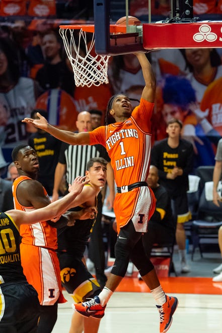 Jan 29, 2021; Champaign, Illinois, USA; Illinois Fighting Illini guard Trent Frazier (1) shoots against the Iowa Hawkeyes during the first half at the State Farm Center.