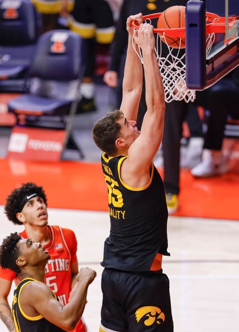 CHAMPAIGN, IL - JANUARY 29: Luka Garza #55 of the Iowa Hawkeyes dunks the ball during the second half at State Farm Center on January 29, 2021 in Champaign, Illinois.