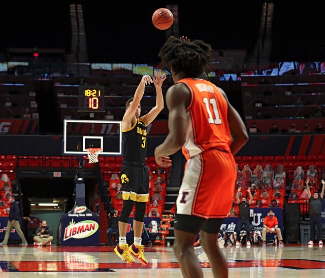 Iowa Hawkeyes guard Jordan Bohannon (3) makes a 3-pointer during the second half of their game, Friday, January 29, 2021, at the State Farm Center in Champaign, Illinois.