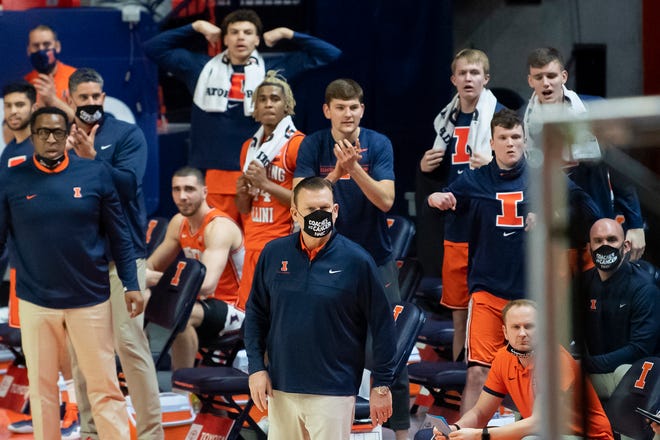 Jan 29, 2021; Champaign, Illinois, USA; Illinois Fighting Illini head coach Brad Underwood looks on as the bench celebrates during the first half against the Iowa Hawkeyes at the State Farm Center.