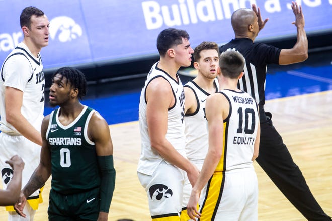 Iowa center Luka Garza celebrates with teammates after drawing a foul during a NCAA Big Ten Conference men's basketball game against Michigan State, Tuesday, Feb. 2, 2021, at Carver-Hawkeye Arena in Iowa City, Iowa.