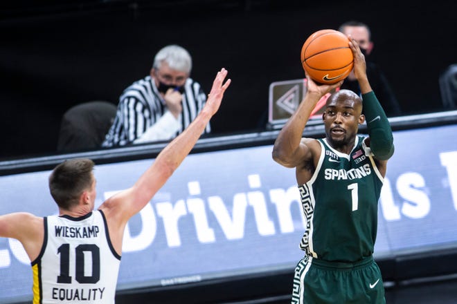 Michigan State guard Joshua Langford (1) makes a 3-point basket as Iowa's Joe Wieskamp (10) defends during a NCAA Big Ten Conference men's basketball game, Tuesday, Feb. 2, 2021, at Carver-Hawkeye Arena in Iowa City, Iowa.
