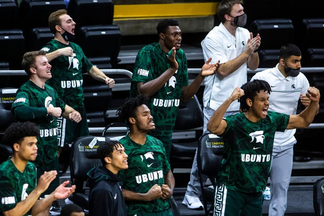 Michigan State Spartans players react on the bench during a NCAA Big Ten Conference men's basketball game, Tuesday, Feb. 2, 2021, at Carver-Hawkeye Arena in Iowa City, Iowa.