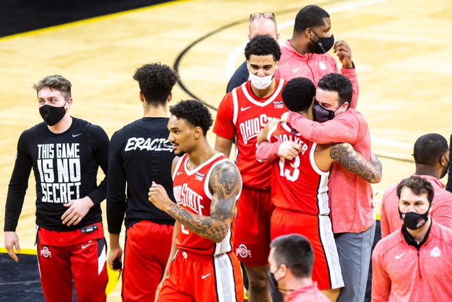 Ohio State Buckeyes players celebrate after beating the Iowa Hawkeyes, 89-85, during a NCAA Big Ten Conference men's basketball game, Thursday, Feb. 4, 2021, at Carver-Hawkeye Arena in Iowa City, Iowa.
