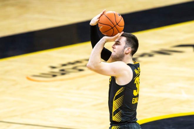 Iowa's Connor McCaffery (30) makes a 3-point basket during a NCAA Big Ten Conference men's basketball game against Ohio State, Thursday, Feb. 4, 2021, at Carver-Hawkeye Arena in Iowa City, Iowa.