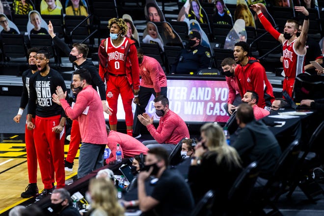Ohio State Buckeyes players celebrate on the bench in the second half during a NCAA Big Ten Conference men's basketball game, Thursday, Feb. 4, 2021, at Carver-Hawkeye Arena in Iowa City, Iowa.