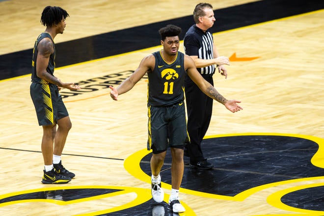 Iowa guard Tony Perkins (11) reacts after getting called for a foul in the second half during a NCAA Big Ten Conference men's basketball game against Ohio State, Thursday, Feb. 4, 2021, at Carver-Hawkeye Arena in Iowa City, Iowa.