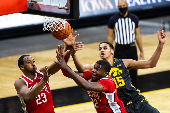 Ohio State forwards Zed Key (23) and E.J. Liddell (32) go up for a rebound against Iowa forward Keegan Murray (15) during a NCAA Big Ten Conference men's basketball game, Thursday, Feb. 4, 2021, at Carver-Hawkeye Arena in Iowa City, Iowa.