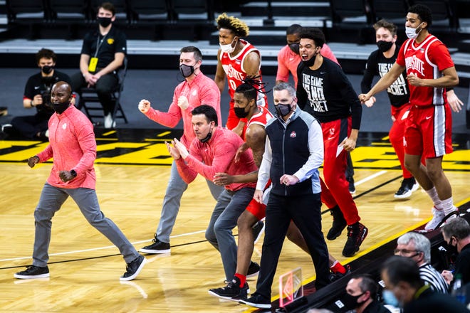 Ohio State head coach Chris Holtmann celebrates with players in the second half during a NCAA Big Ten Conference men's basketball game, Thursday, Feb. 4, 2021, at Carver-Hawkeye Arena in Iowa City, Iowa.