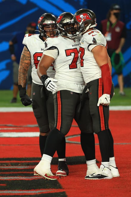 TAMPA, FLORIDA - FEBRUARY 07: Rob Gronkowski #87 and Tristan Wirfs #78 of the Tampa Bay Buccaneers celebrate a touchdown during the second quarter in Super Bowl LV at Raymond James Stadium on February 07, 2021 in Tampa, Florida.