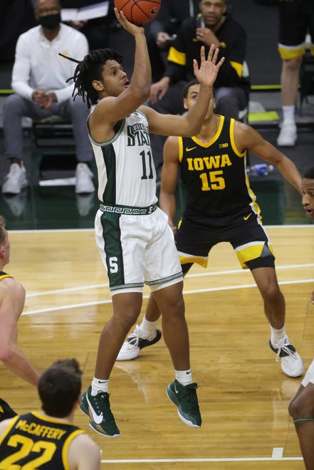 Michigan State Spartans guard A.J. Hoggard (11) shoots against the Iowa Hawkeyes during first half action at Breslin Center Saturday, Feb. 13, 2021.