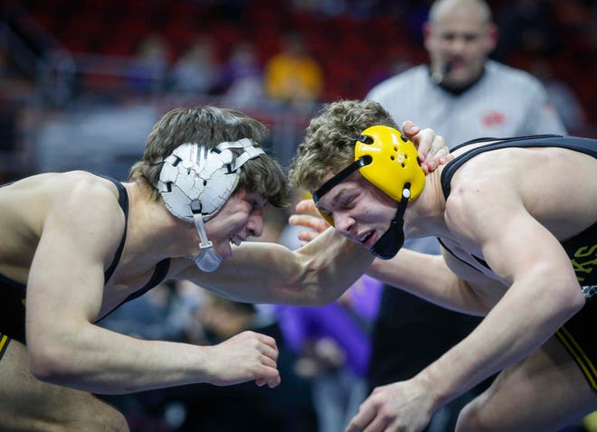 Southeast Polk's Joel Jesuroga, left, ties up with Waverly-Shell Rock's Aiden Riggins in their match at 152 pounds in Class 3A during the Iowa high school state dual wrestling tournament on Wednesday, Feb. 17, 2021, at Wells Fargo Arena in Des Moines.