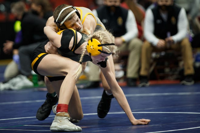 Bettendorf's Ella Schmit wrestles Waverly-Shell Rock's Zane Behrends during their class 3A 106 pound match at the Iowa high school state wrestling tournament on Thursday, Feb. 18, 2021, in Des Moines, IA.