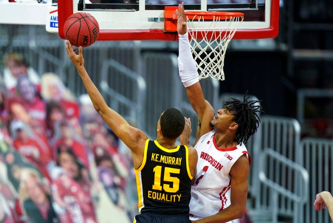 Iowa's Keegan Murray (15) shoots against Wisconsin's Aleem Ford during the second half of an NCAA college basketball game Thursday, Feb. 18, 2021, in Madison, Wis. (AP Photo/Andy Manis)