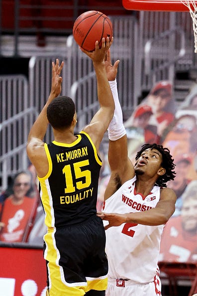 MADISON, WISCONSIN - FEBRUARY 18: Keegan Murray #15 of the Iowa Hawkeyes attempts a shot while being guarded by Aleem Ford #2 of the Wisconsin Badgers in the first half at the Kohl Center on February 18, 2021 in Madison, Wisconsin. (Photo by Dylan Buell/Getty Images)