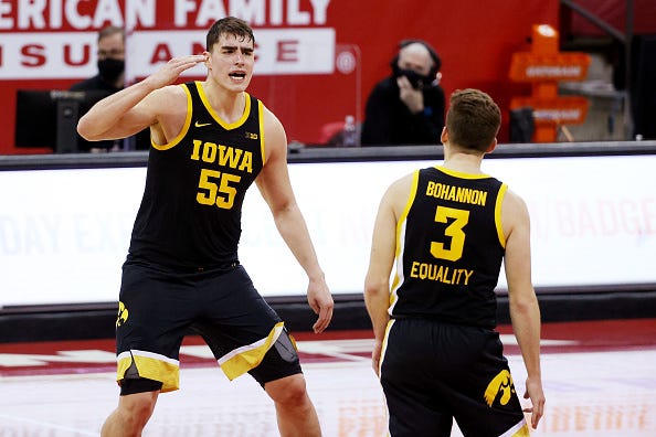MADISON, WISCONSIN - FEBRUARY 18: Luka Garza #55 and Jordan Bohannon #3 of the Iowa Hawkeyes react in the second half against the Wisconsin Badgers at the Kohl Center on February 18, 2021 in Madison, Wisconsin. (Photo by Dylan Buell/Getty Images)
