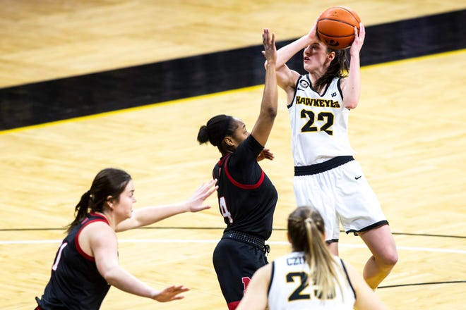 Iowa guard Caitlin Clark (22) makes a basket as Nebraska guard Sam Haiby defends during a NCAA Big Ten Conference women's basketball game, Saturday, March 6, 2021, at Carver-Hawkeye Arena in Iowa City, Iowa.