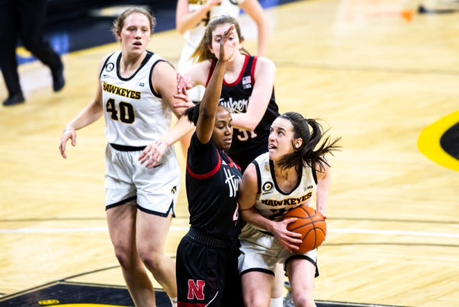 Iowa guard Caitlin Clark (22) drives to the basket against Nebraska guard Sam Haiby during a NCAA Big Ten Conference women's basketball game, Saturday, March 6, 2021, at Carver-Hawkeye Arena in Iowa City, Iowa.