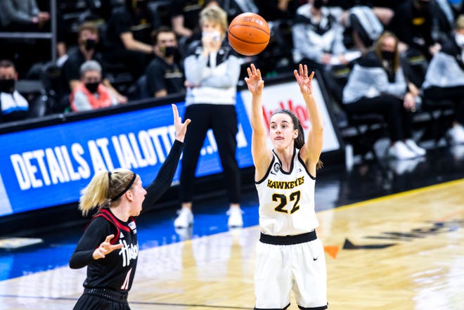Iowa guard Caitlin Clark (22) makes a 3-point basket as Nebraska guard Ruby Porter defends during a NCAA Big Ten Conference women's basketball game, Saturday, March 6, 2021, at Carver-Hawkeye Arena in Iowa City, Iowa.