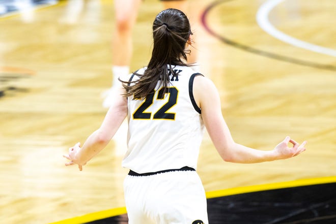 Iowa guard Caitlin Clark (22) reacts after making a 3-point basket during a NCAA Big Ten Conference women's basketball game against Nebraska, Saturday, March 6, 2021, at Carver-Hawkeye Arena in Iowa City, Iowa.