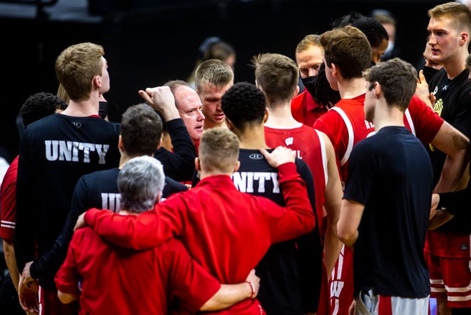 Wisconsin head coach Greg Gard talks with players during a NCAA Big Ten Conference men's basketball game against Iowa, Sunday, March 7, 2021, at Carver-Hawkeye Arena in Iowa City, Iowa.