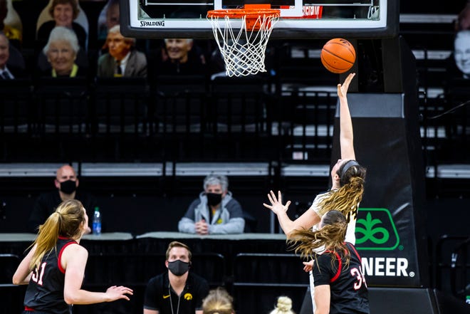 Iowa's McKenna Warnock makes a basket during a NCAA Big Ten Conference women's basketball game against Nebraska, Saturday, March 6, 2021, at Carver-Hawkeye Arena in Iowa City, Iowa.