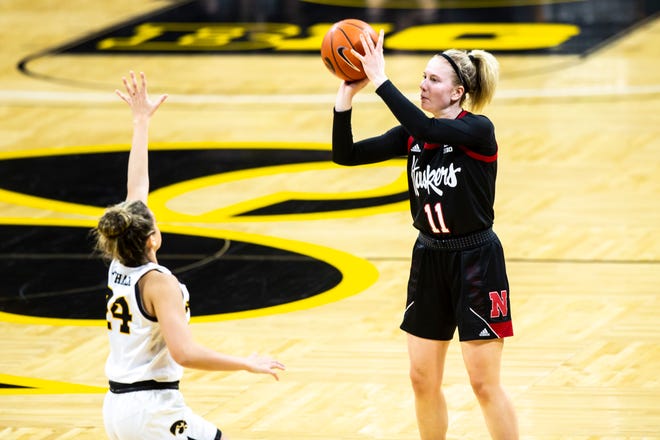 Nebraska guard Ruby Porter (11) makes a 3-point basket as Iowa guard Gabbie Marshall (24) defends during a NCAA Big Ten Conference women's basketball game, Saturday, March 6, 2021, at Carver-Hawkeye Arena in Iowa City, Iowa.