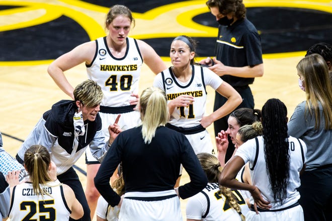 Iowa associate head coach Jan Jensen talks with players in a timeout during a NCAA Big Ten Conference women's basketball game against Nebraska, Saturday, March 6, 2021, at Carver-Hawkeye Arena in Iowa City, Iowa.