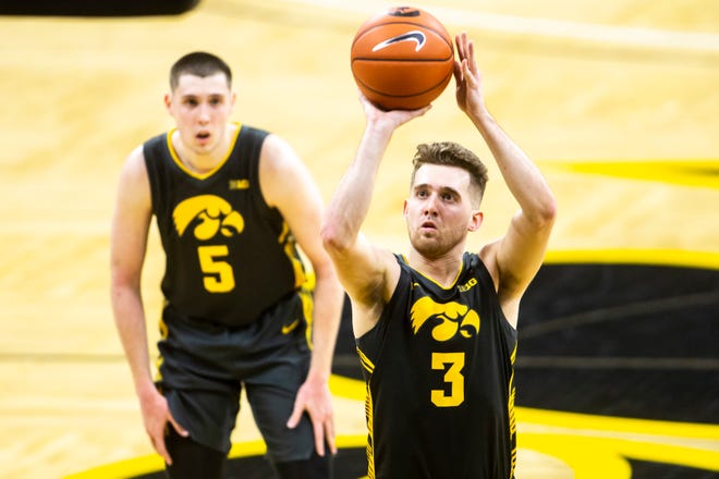 Iowa guard Jordan Bohannon (3) makes a free throw during a NCAA Big Ten Conference men's basketball game against Wisconsin, Sunday, March 7, 2021, at Carver-Hawkeye Arena in Iowa City, Iowa.